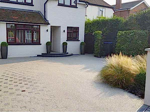 Front garden design in Woking Surrey with resin driveway