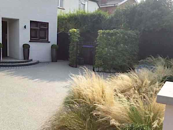 Front garden design in Woking Surrey with resin driveway