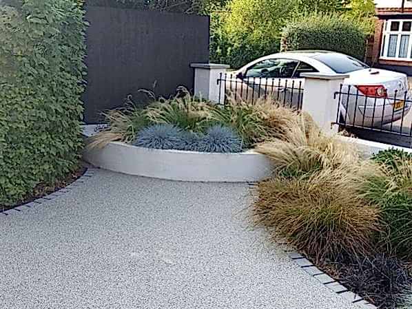 Front garden design in Woking Surrey with resin driveway