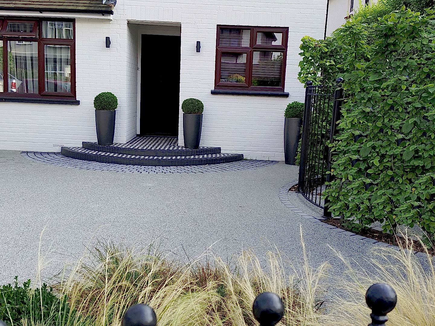 Front garden design in Woking Surrey with resin driveway