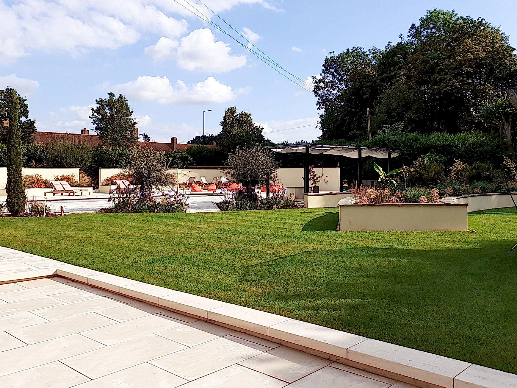 Garden design in Windsor Berkshire with swimming pool and outdoor kitchen